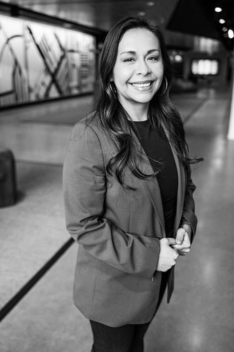 A black-and-white portrait of of Deanna Hernandez, field marketing officer at McDonald’s.