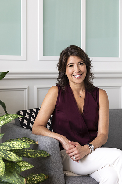 Maria Moret, Chief of Staff, Airbnb, portrait sitting on couch
