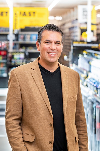 Adolfo Rodriguez, SVP of IT Transformation, Advance Auto Parts_portrait brown jacket